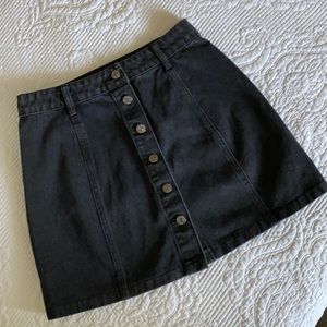 Black denim mini skirt.